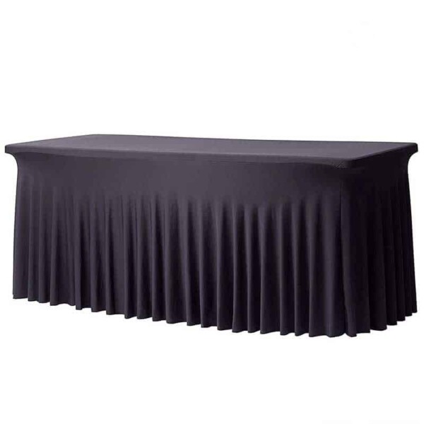 Une NAPPE BLANCHE HOUSSE RECTANGULAIRE JUPE EXTENSIBLE 60 cm x 200 cm recouvre la table d'une jupe ajustée et plissée qui atteint le sol de tous les côtés.
